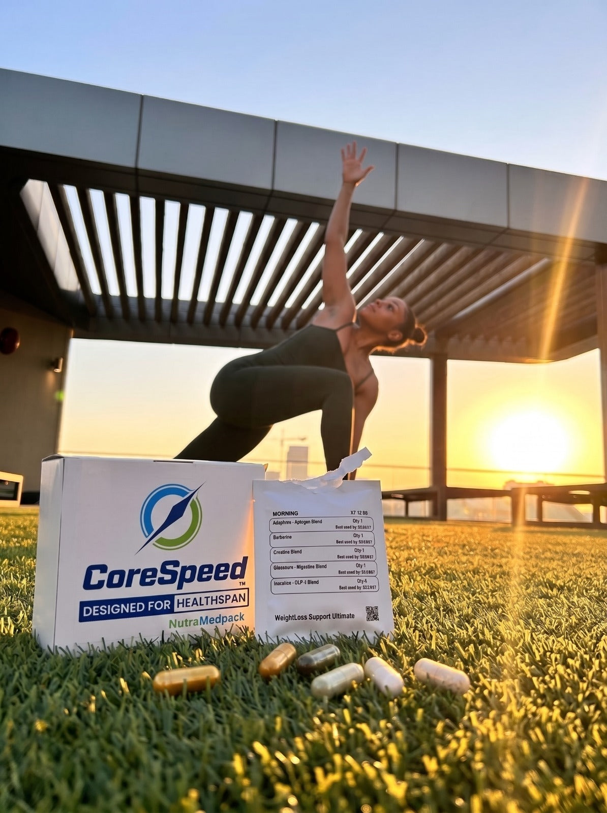 Woman practicing a balanced pose on a sunlit rooftop